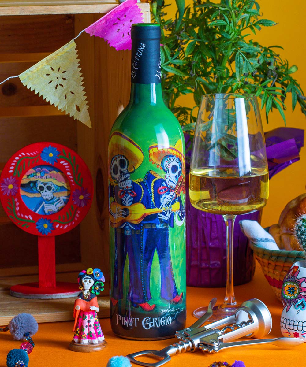 La Catrina Pinot Grigio bottle in Day of the Dead themed background