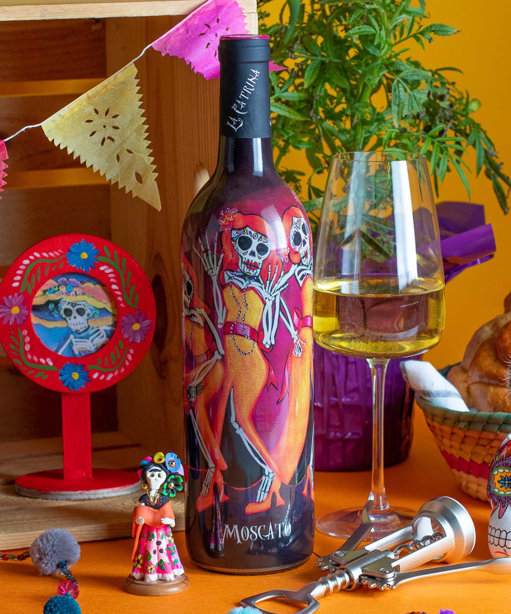La Catrina Moscato bottle in Day of the Dead themed background