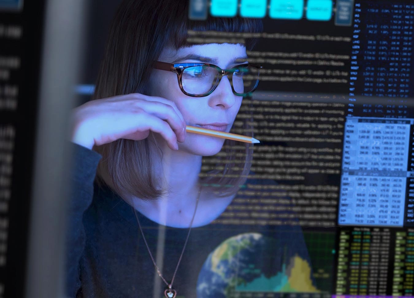 woman analyzing computer display