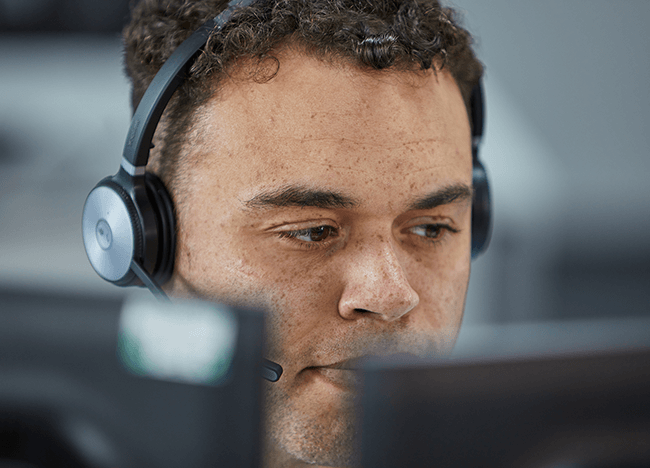 man in headset looking focused
