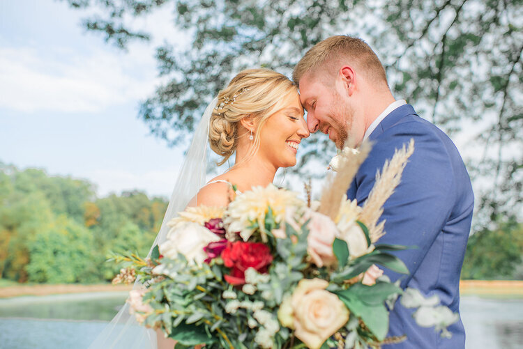 BrideAndGroom-Couple-BeautifulFlowers-SimplyPicturesque.jpeg