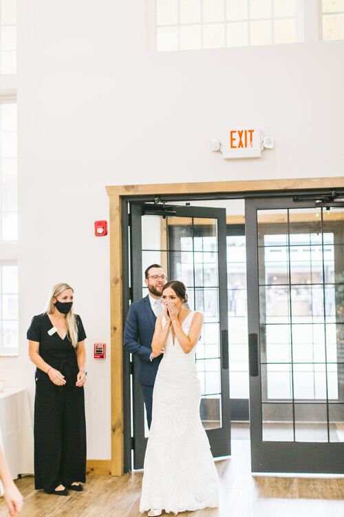 BrideAndGroomFirstReceptionLook-FirstLookWeddingReception-ErikaLynnPhotography.jpeg