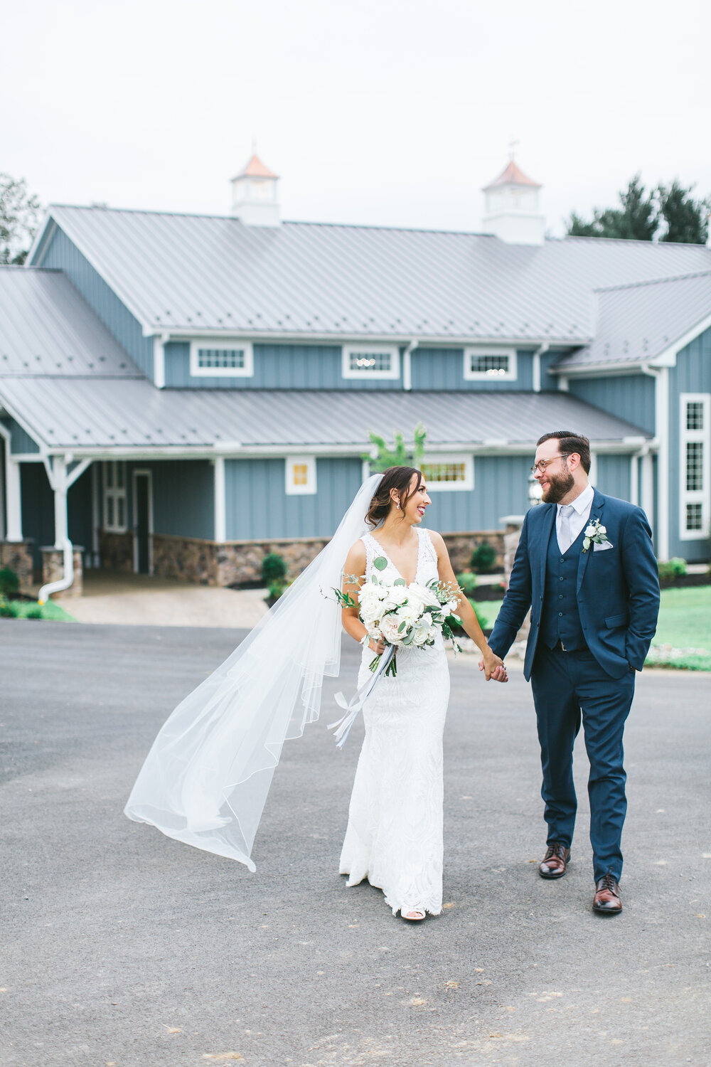 BrideAndGroomHoldingHands-WeddingVeil-Bouquet-ErikaLynnPhotography.jpg