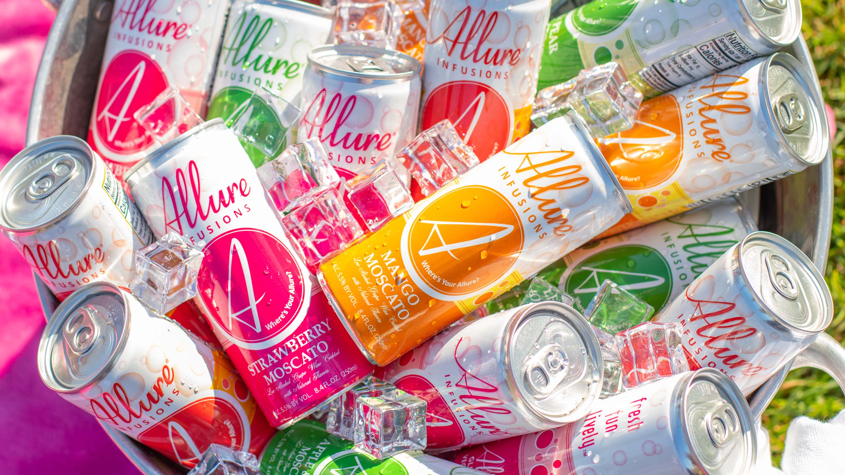 An ice bucket filled with cans of Allure Infusions Moscato