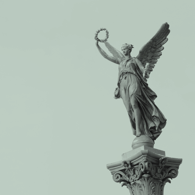 lady justice on column holding wreath