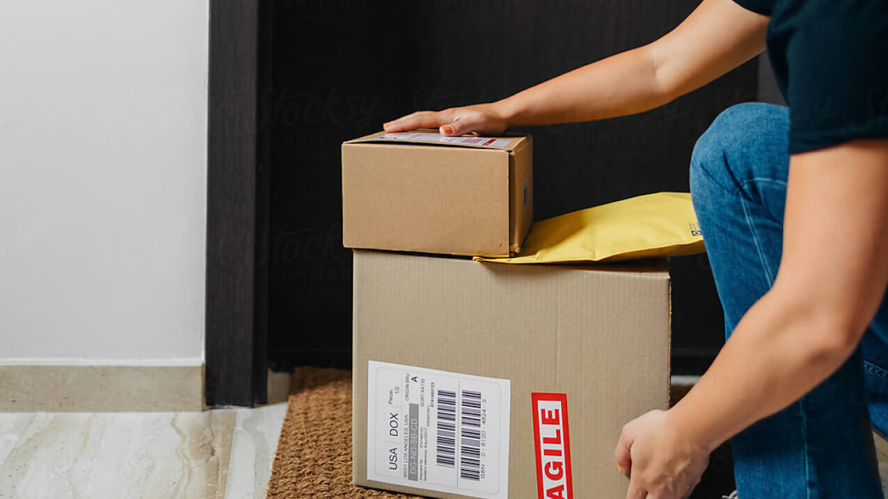 Deliveryman carring multiple packages