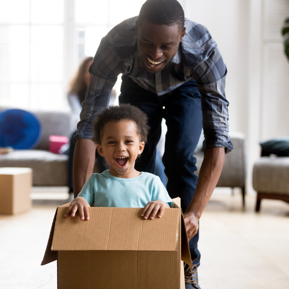 Black man playing with son