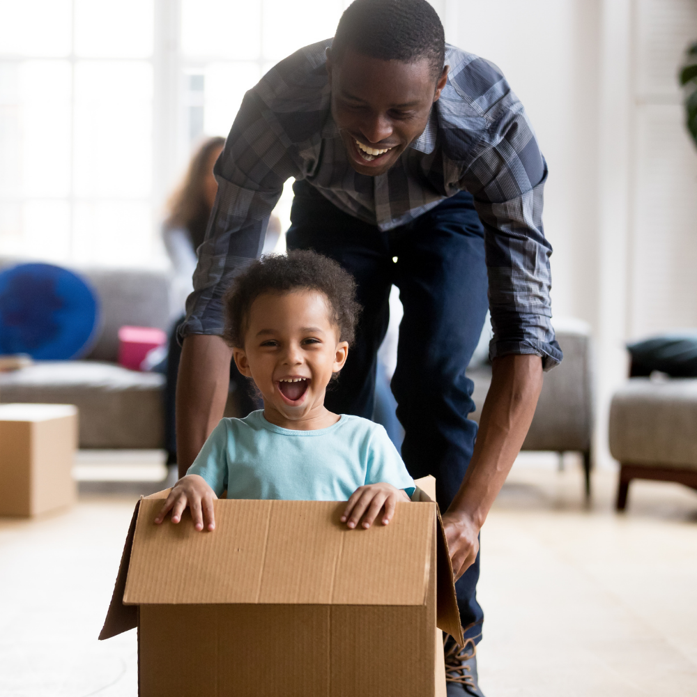 Black man playing with son
