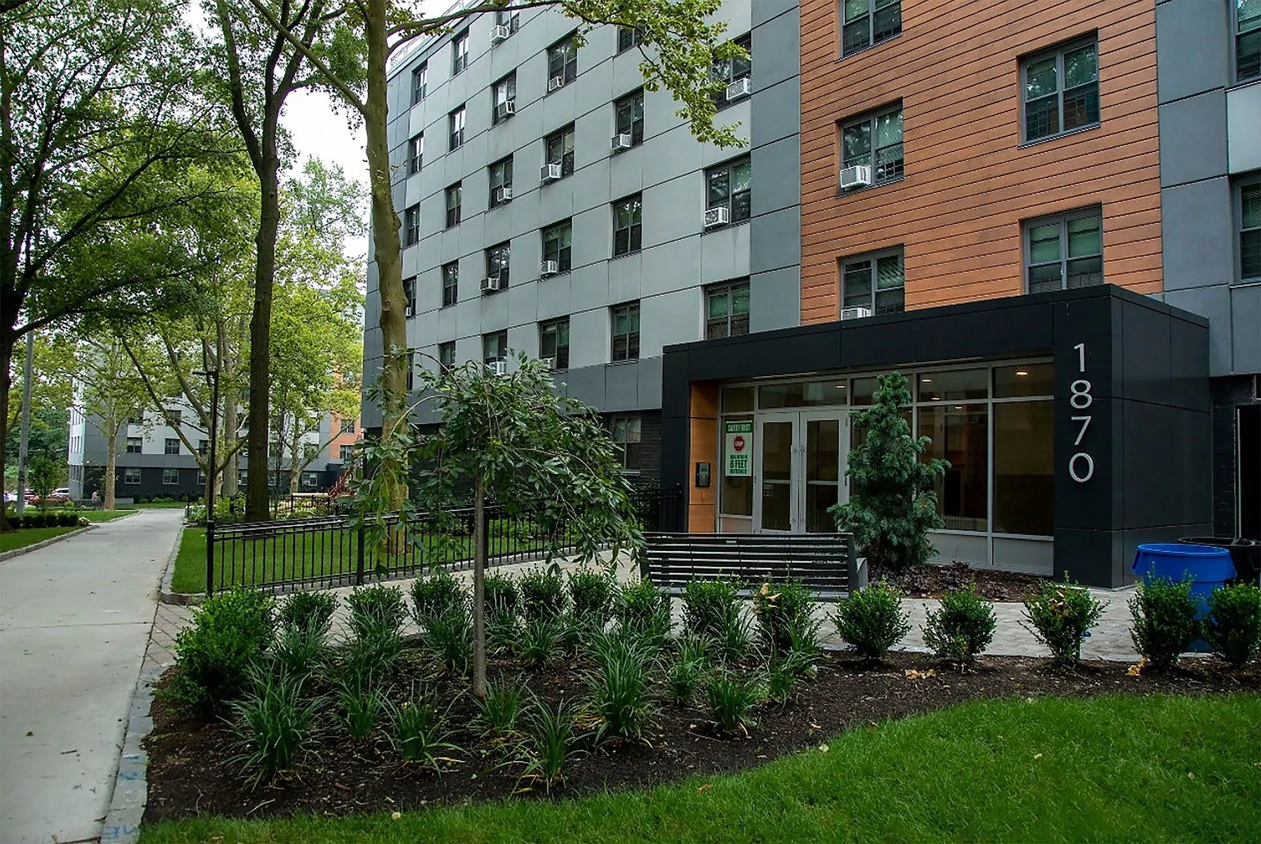Renovated entrance of the Baychester and Murphy apartment building in The Bronx