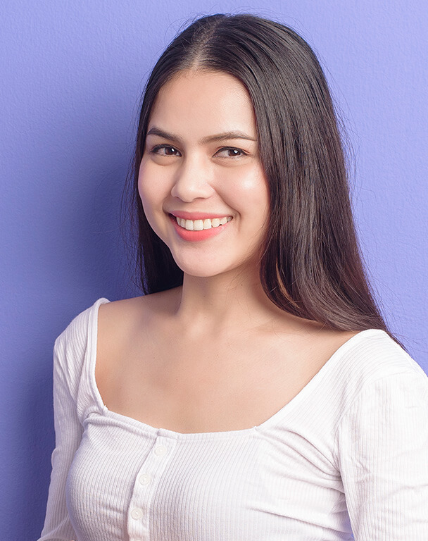 Smiling young woman with healthy-looking skin