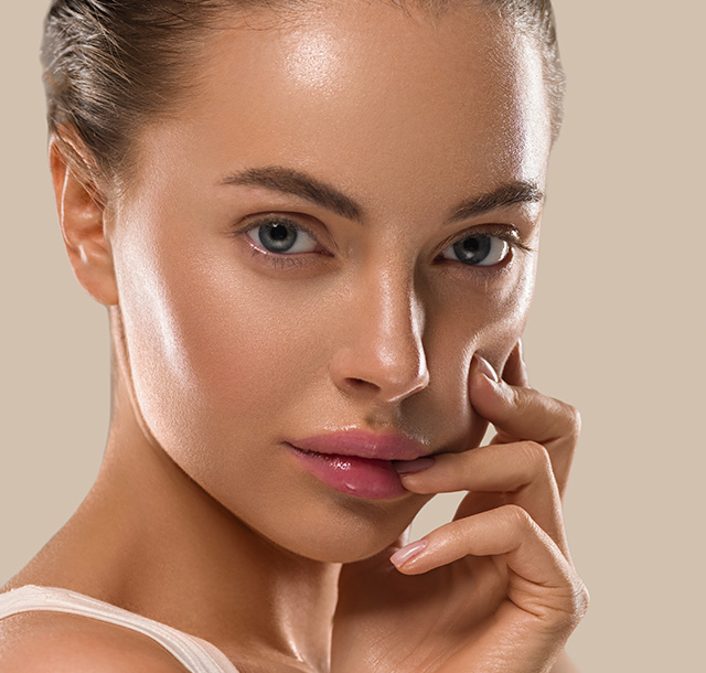 Young woman's face with radiant and wrinkle-free skin for anti-wrinkle injections