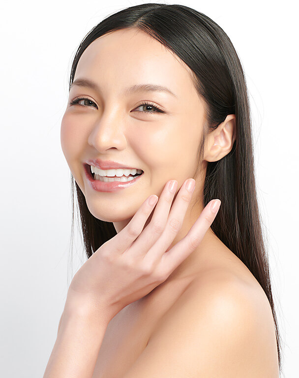 Beautiful woman with asian features, smiling with radiant-looking skin for PRP Facial Rejuvenation