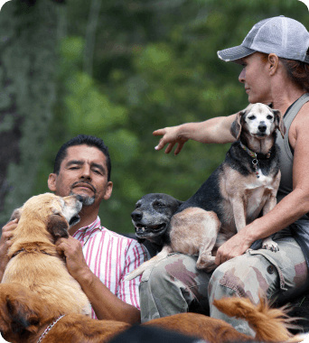 image of men and women with dogs