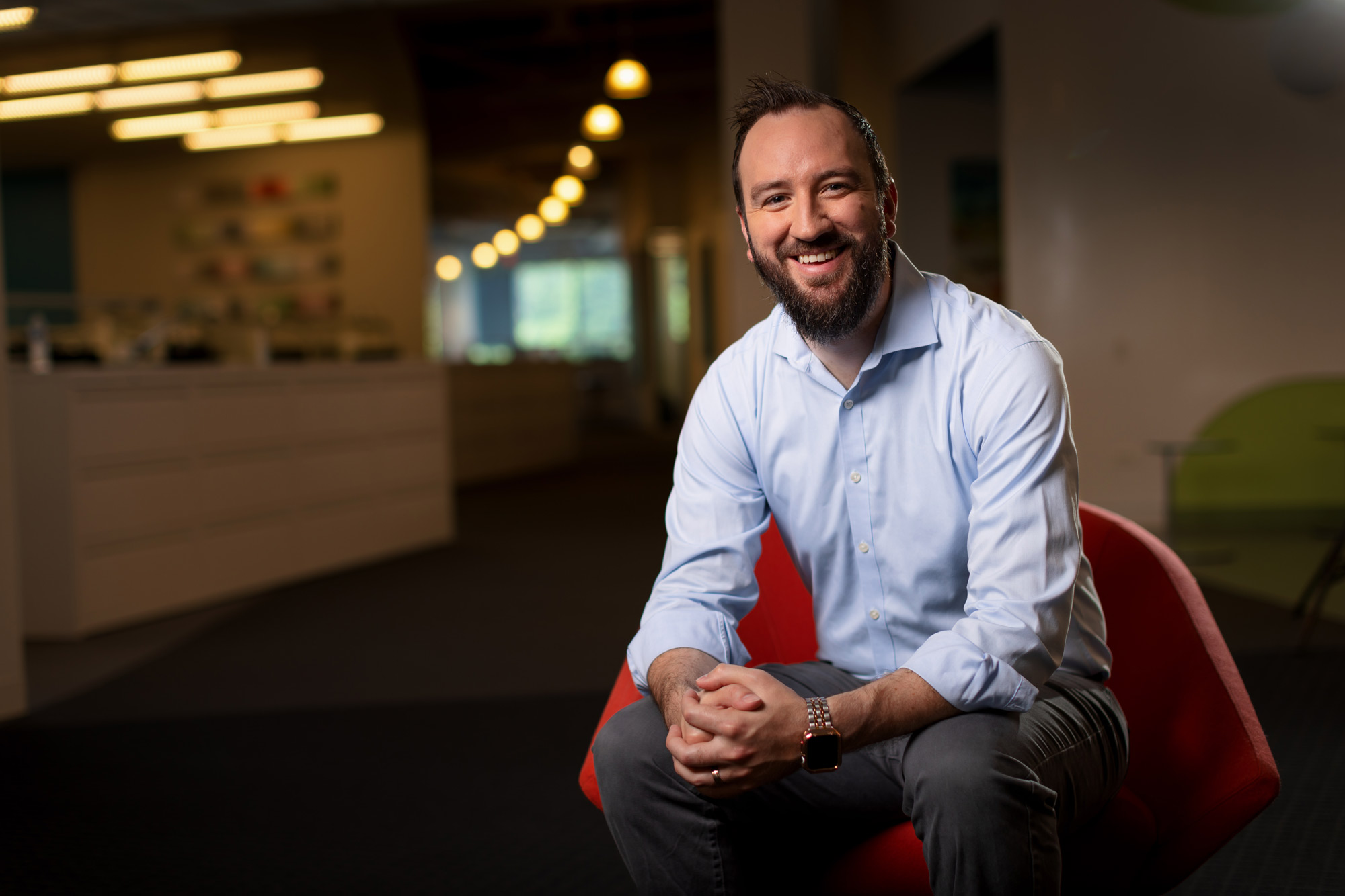 Scott smiling in a chair