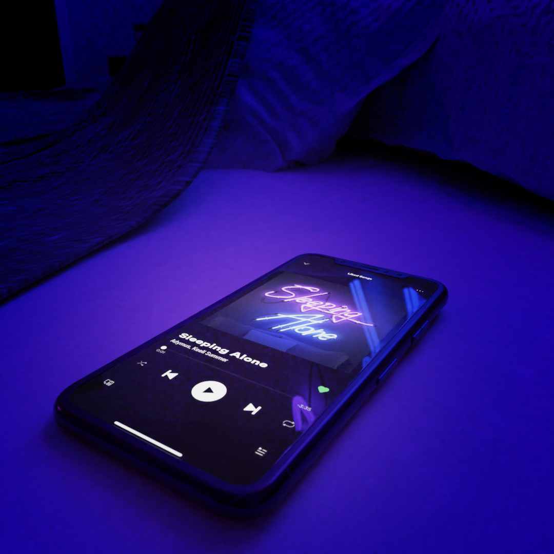 "Sleeping Alone" single playing on phone screen