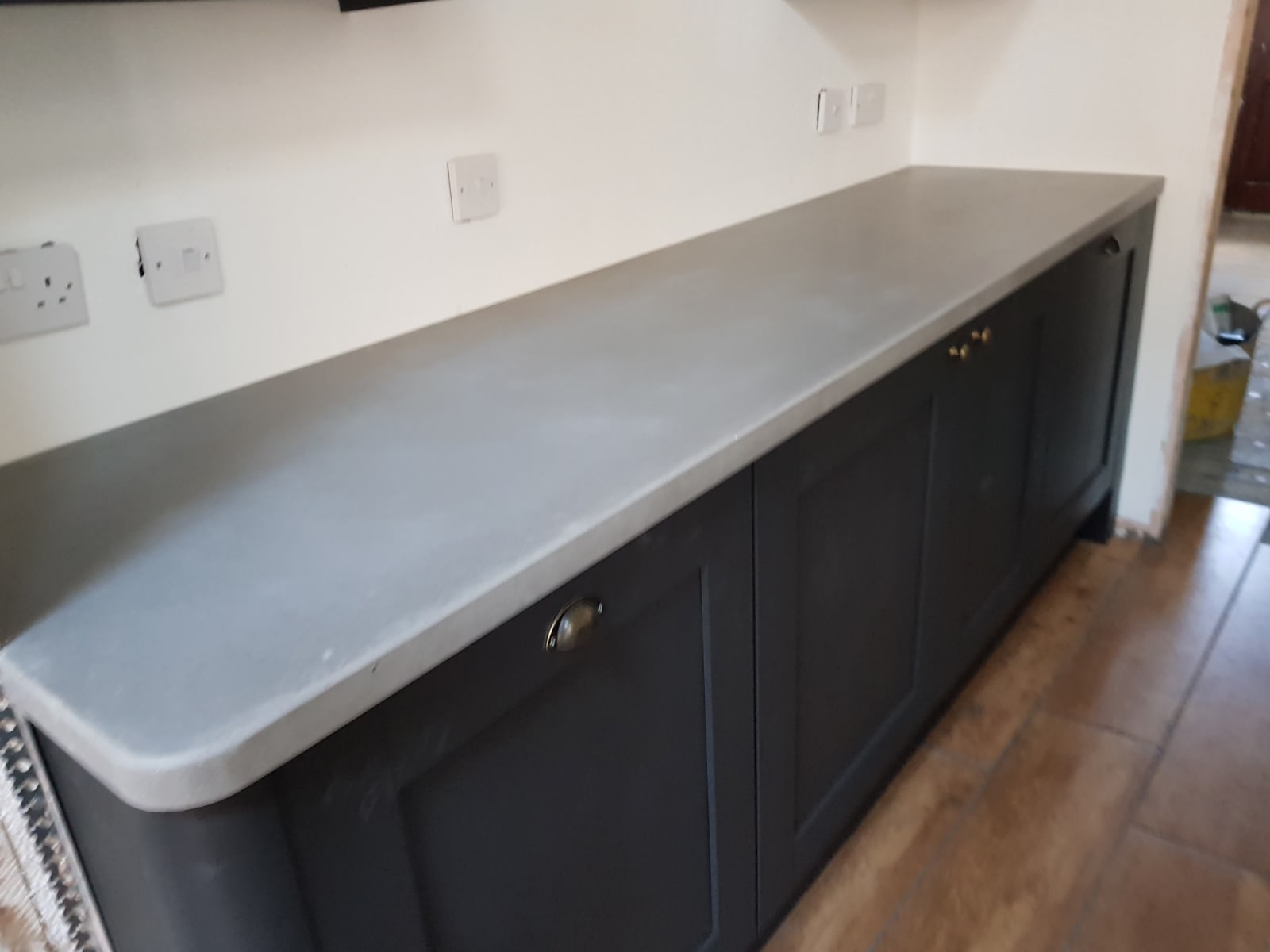 Light grey kitchen concrete worktop and island fitted in LondonLondon E10
