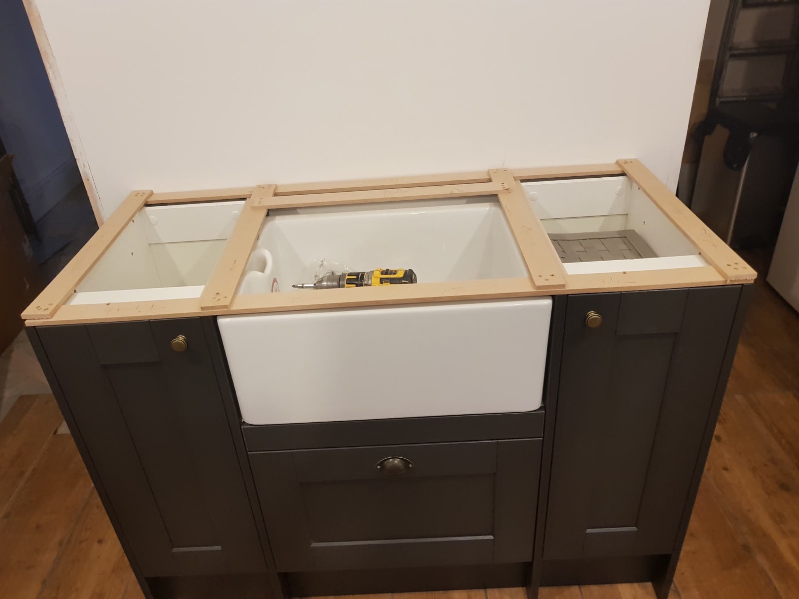 Light grey kitchen concrete worktop and island fitted in LondonLondon E10