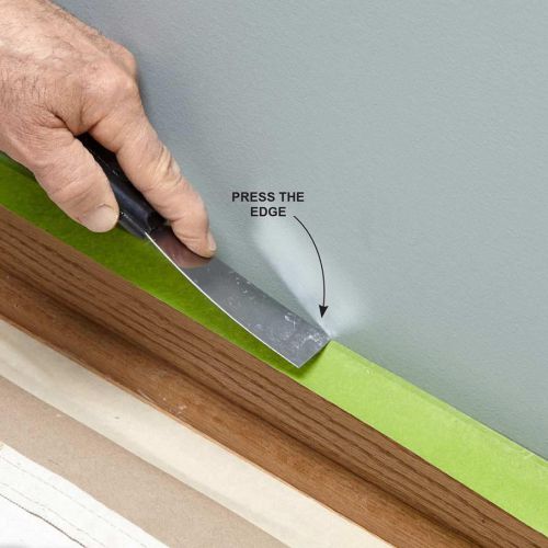 Tekan lakban kertas sebagai cara mengecat dinding menggunakan masking tape