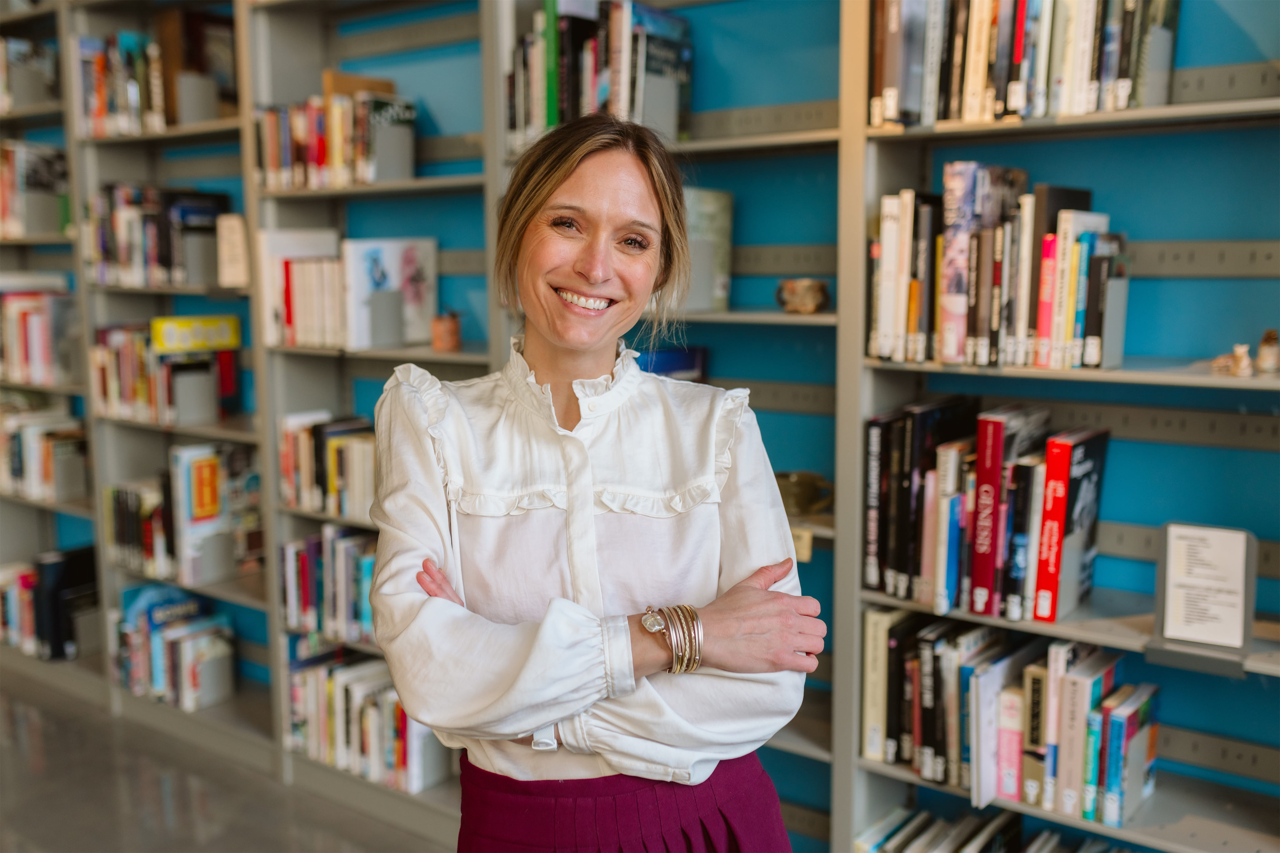 A photo of a teacher in the school libraryu