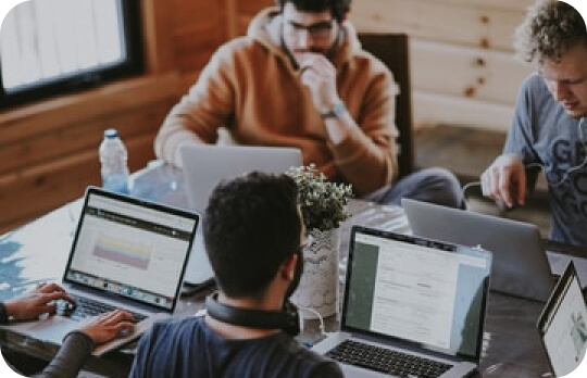 people working on computers in office