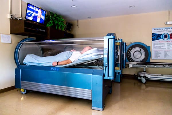 A patient receiving Hyperbaric Oxygen Therapy