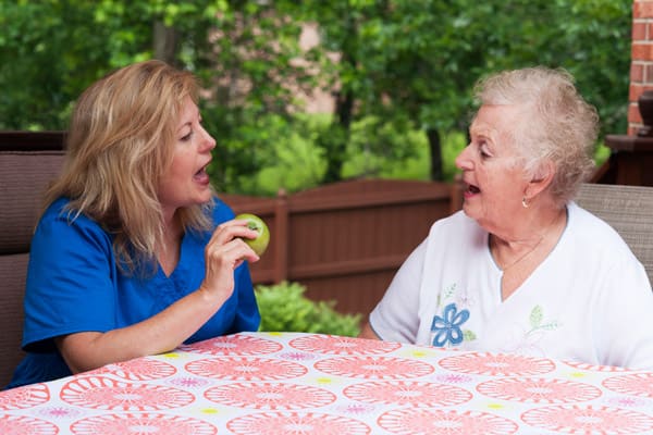A lady with a speech therapist