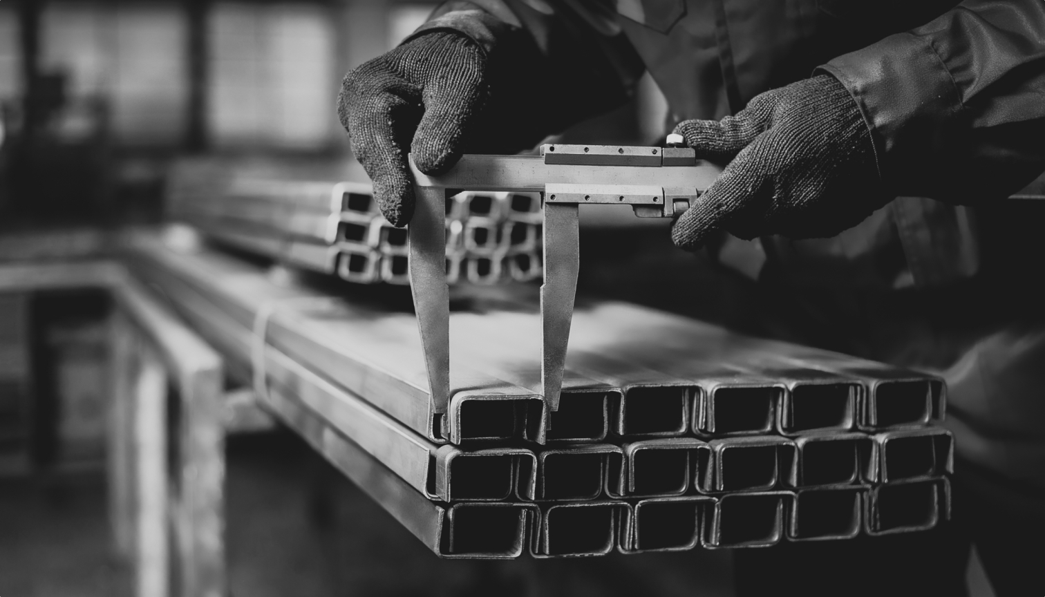 Worker measuring industry parts