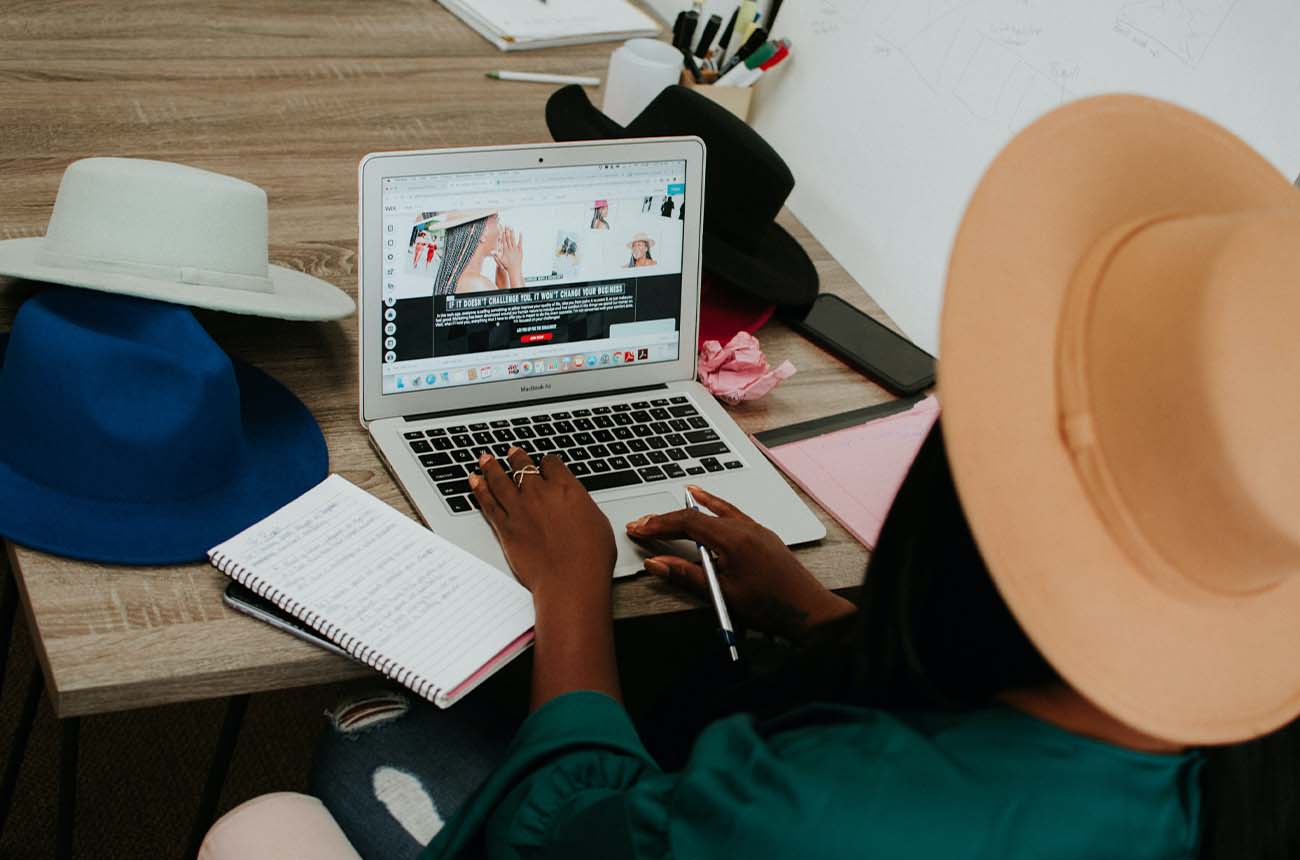African American woman updating the content on her website