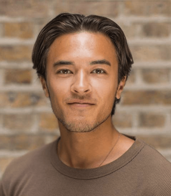 Lewis Sparks wearing a brown T-shirt