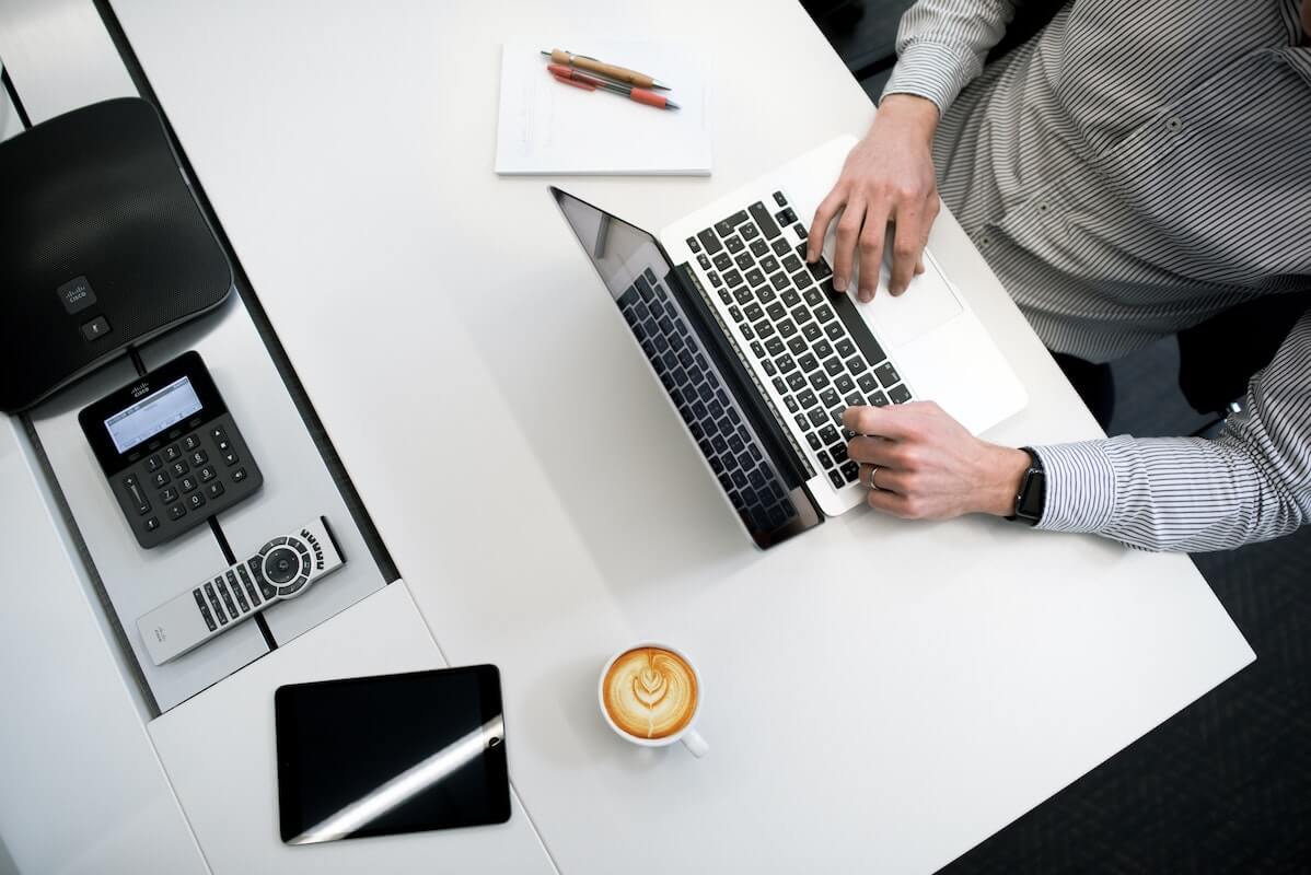 Man typing on his Mac