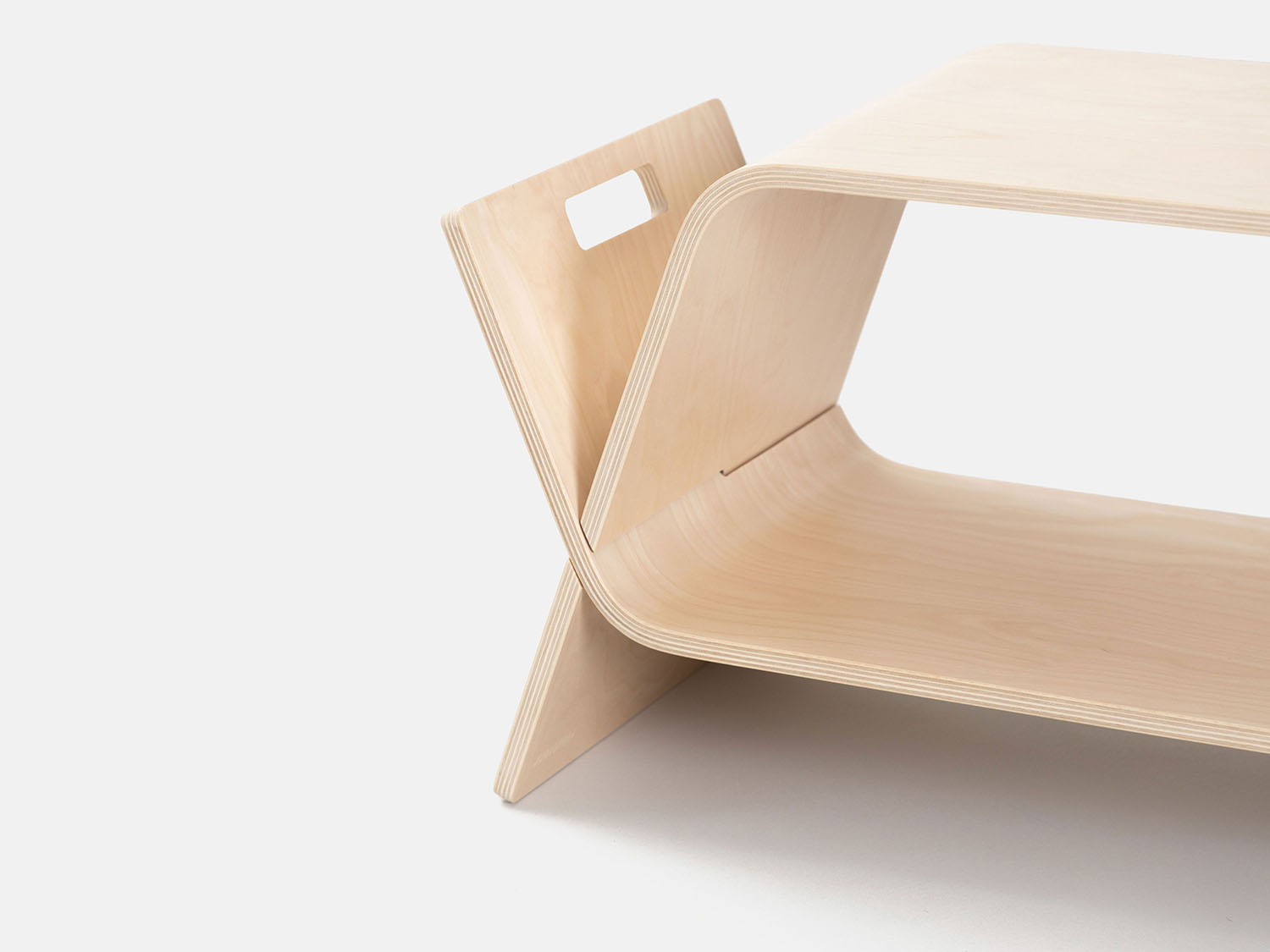 The embrace table on a white studio background