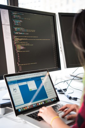 Woman coding and organising tasks on online platform