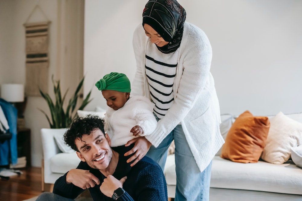 Family in living room looking very happy