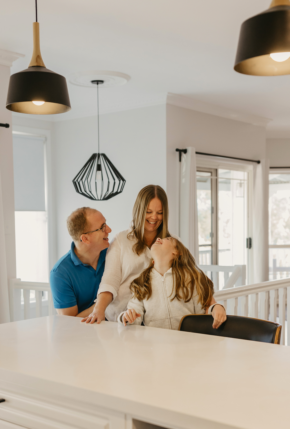 Picture of family at kitchen looking very happy
