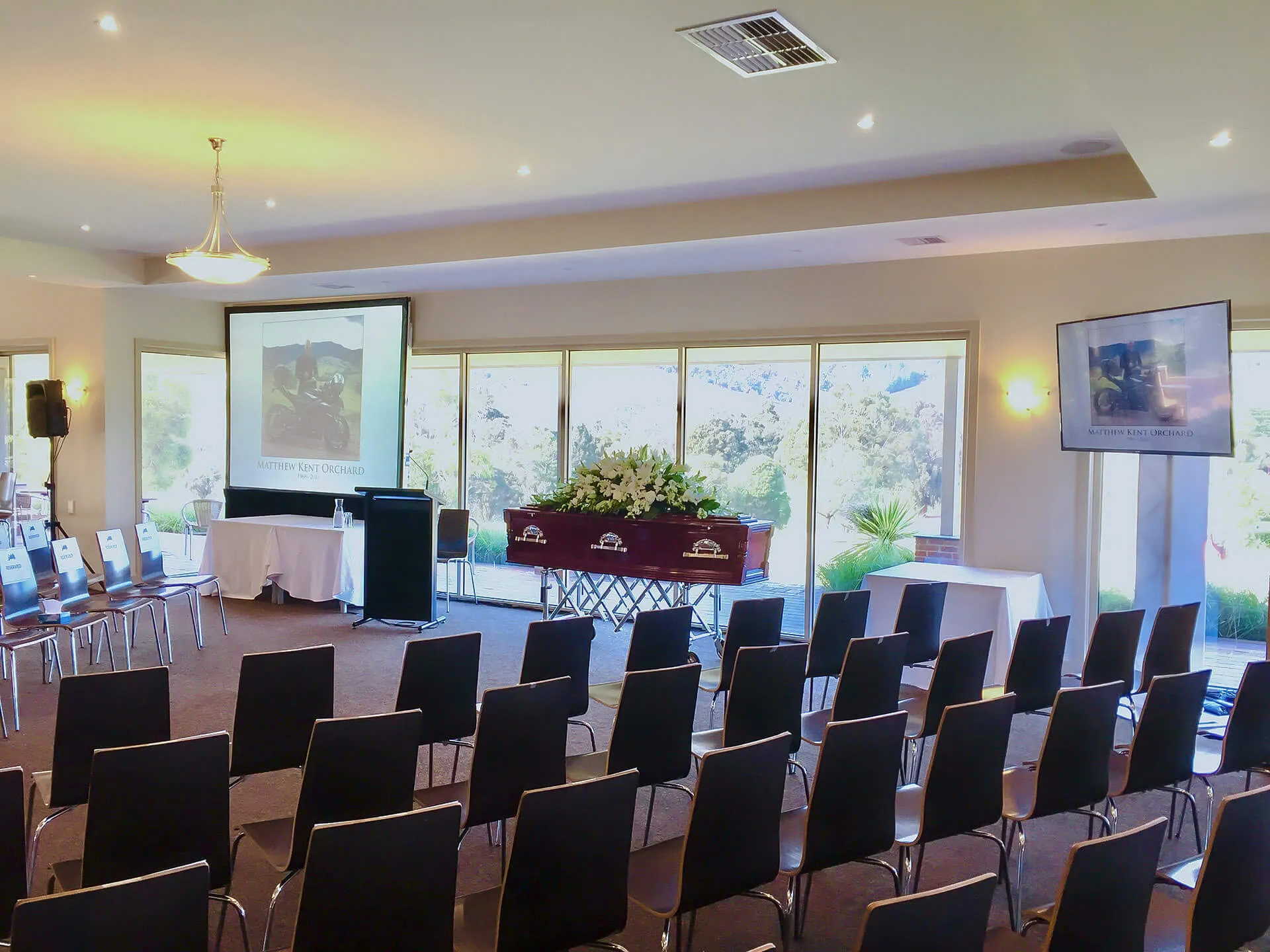 funeral service with chairs in a row
