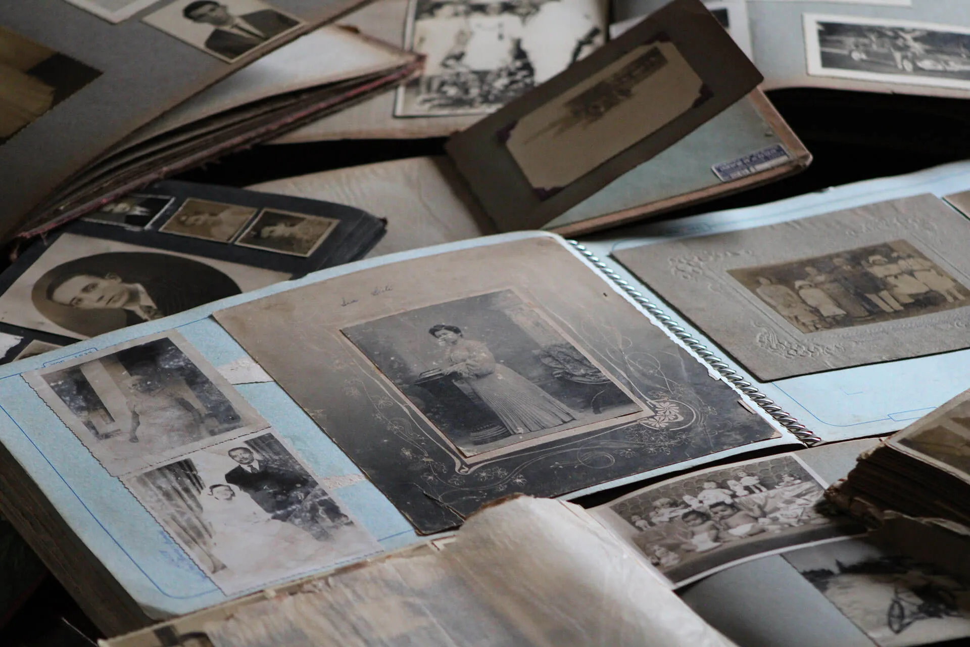 old vintage photos stacked on top of each other