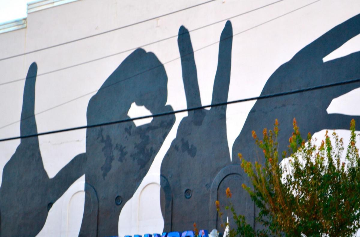 Street art on wall of hands