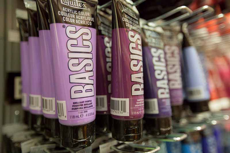Acrylic paint tubes displayed for sale in Atelier Phuong's physical store