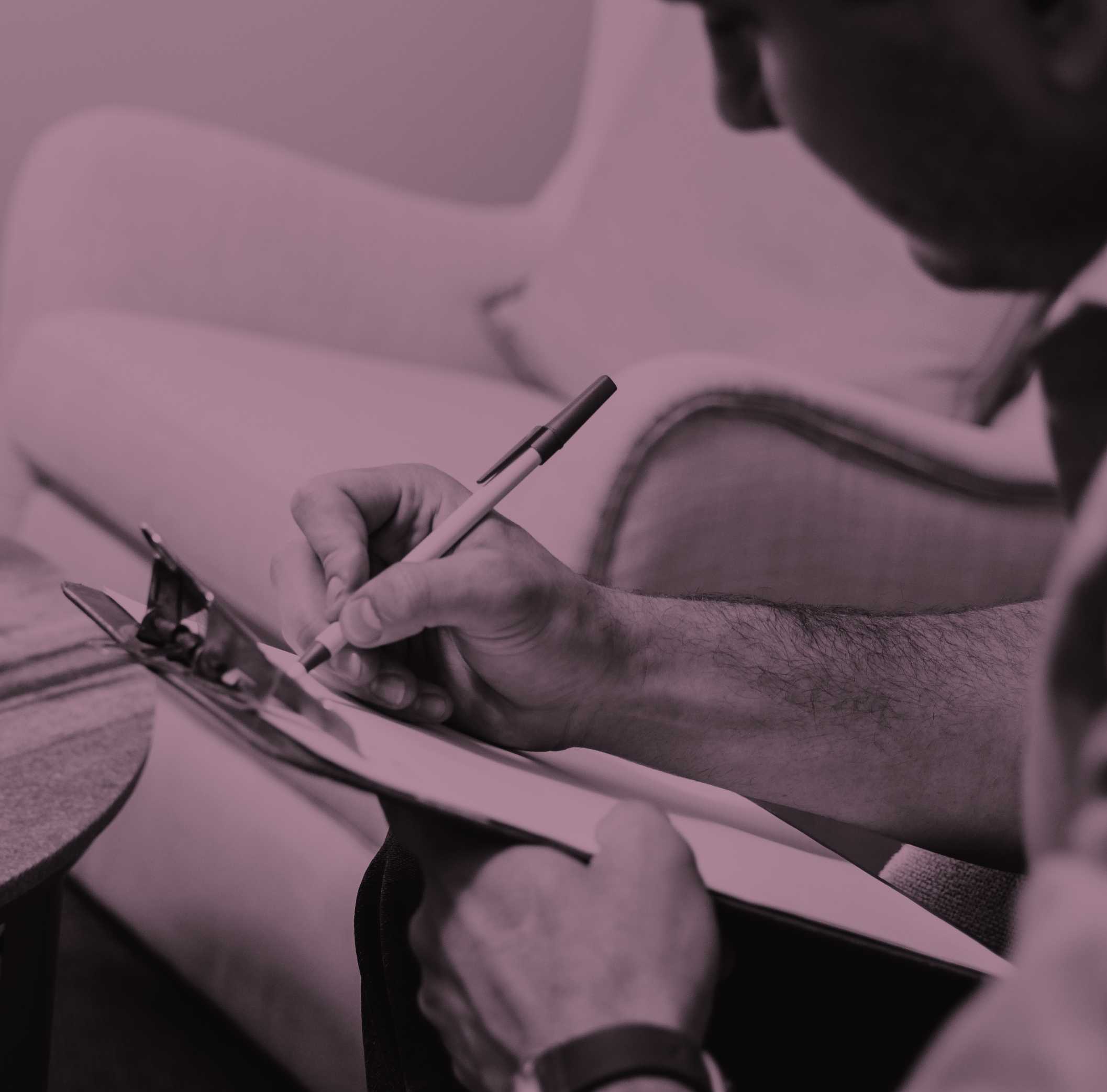 A male patient writing