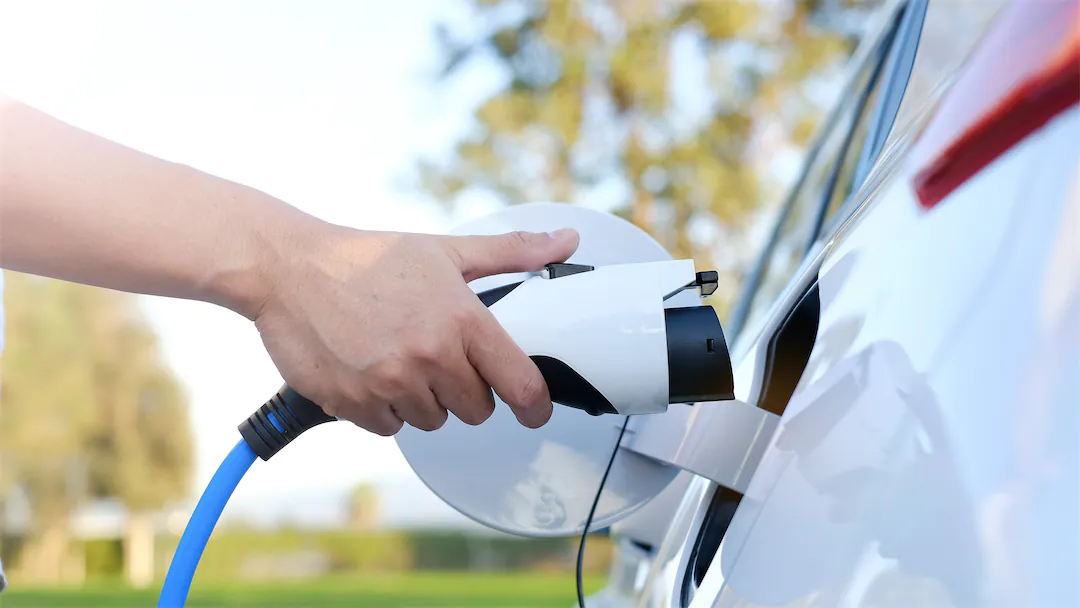 Electric car charging at station