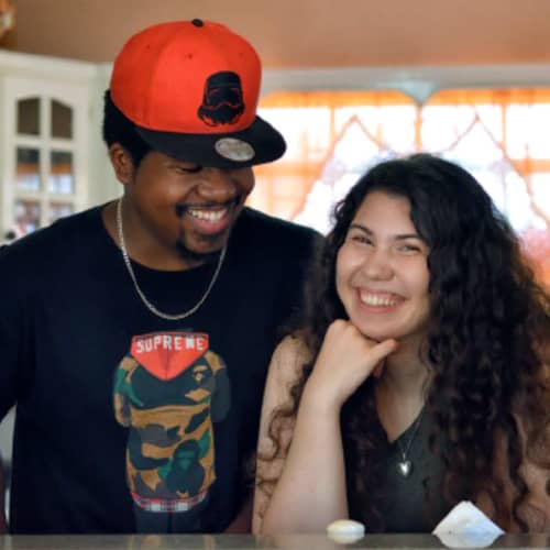 An interracial couple in the kitchen.