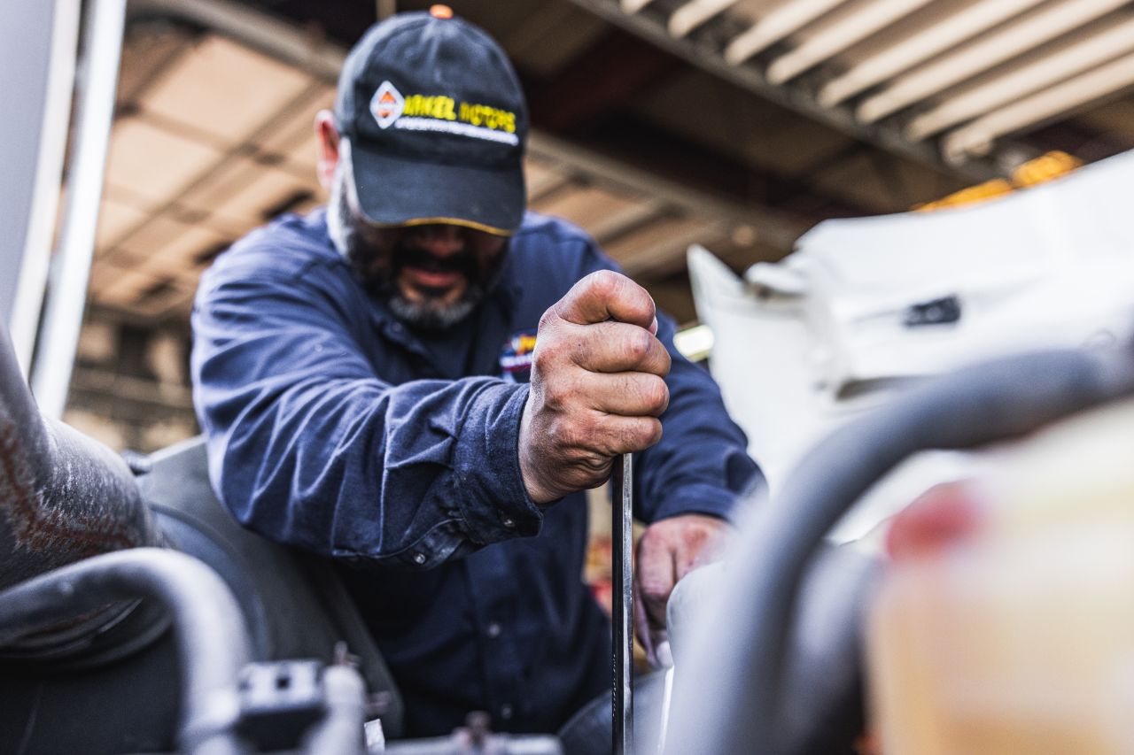 Mechanic repairing heavy-duty steering issues at Fran Rock.