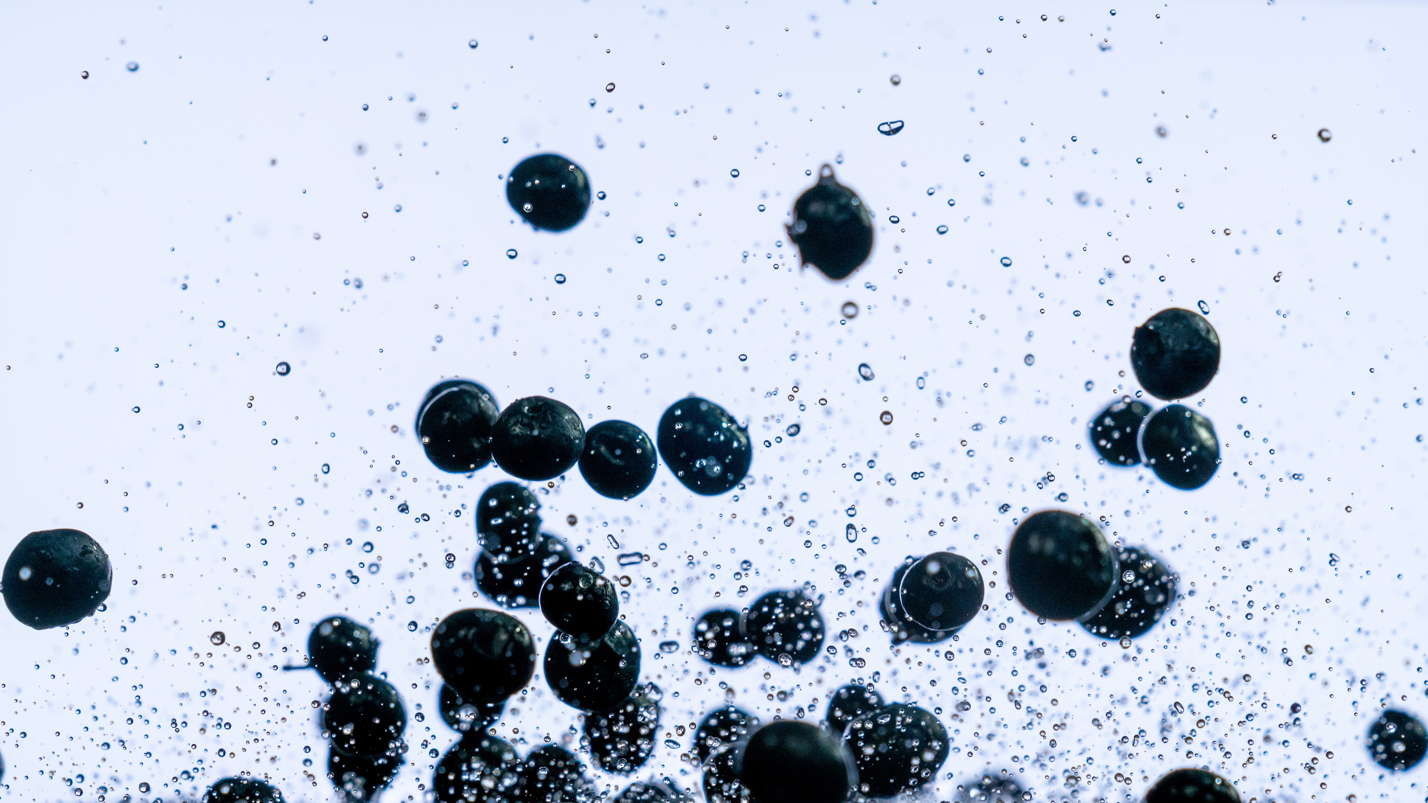 a splash of water and blueberries