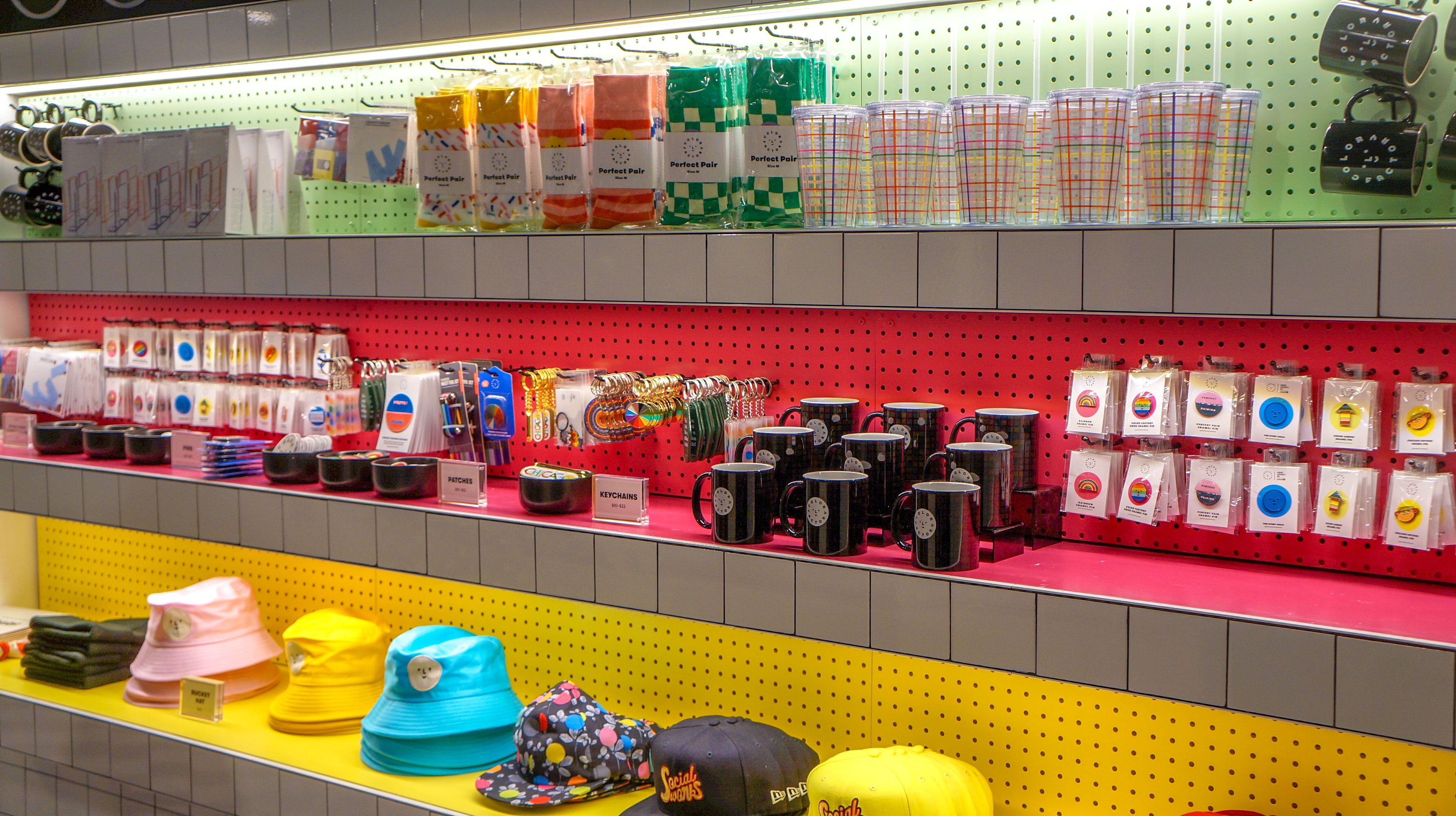 hats and mugs on colorful shelves