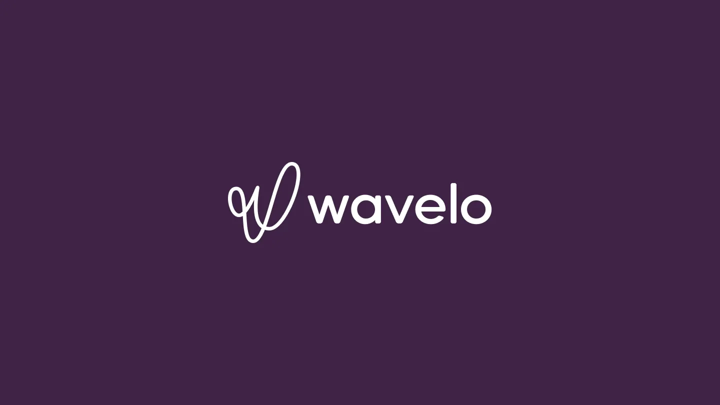 A dark purple screen with the Wavelo logo in the center