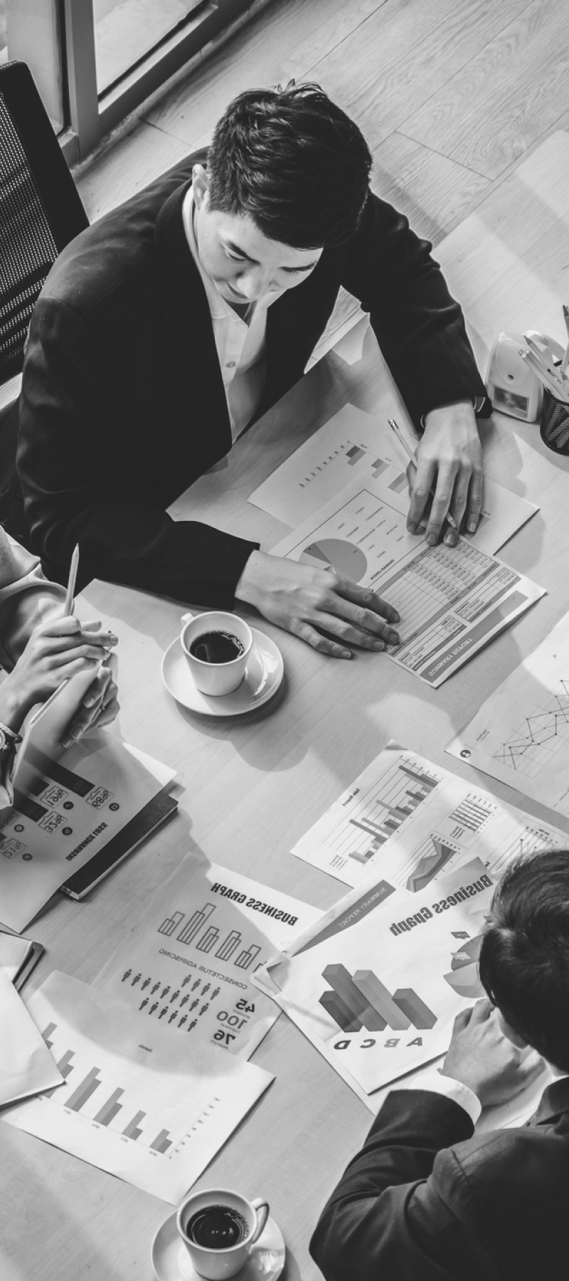 Man looking at business graphics