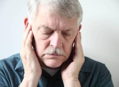 man holding jaw from pain in huntsville al