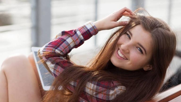 girl smiling after dental extraction in Huntsville, AL