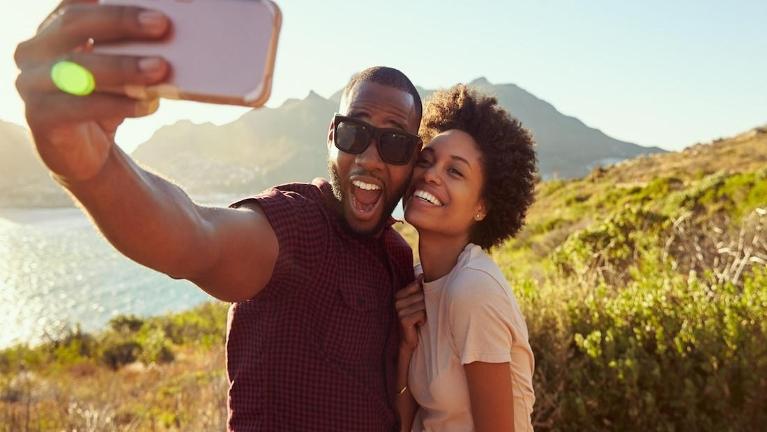 Couple outdoors taking a selfie | Dental Implants Huntsville AL