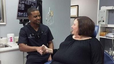Dr. David King meeting a patient at his Huntsville office